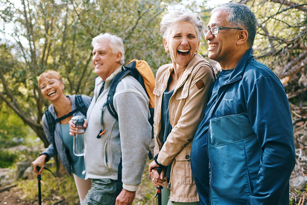 older people hiking and smiling